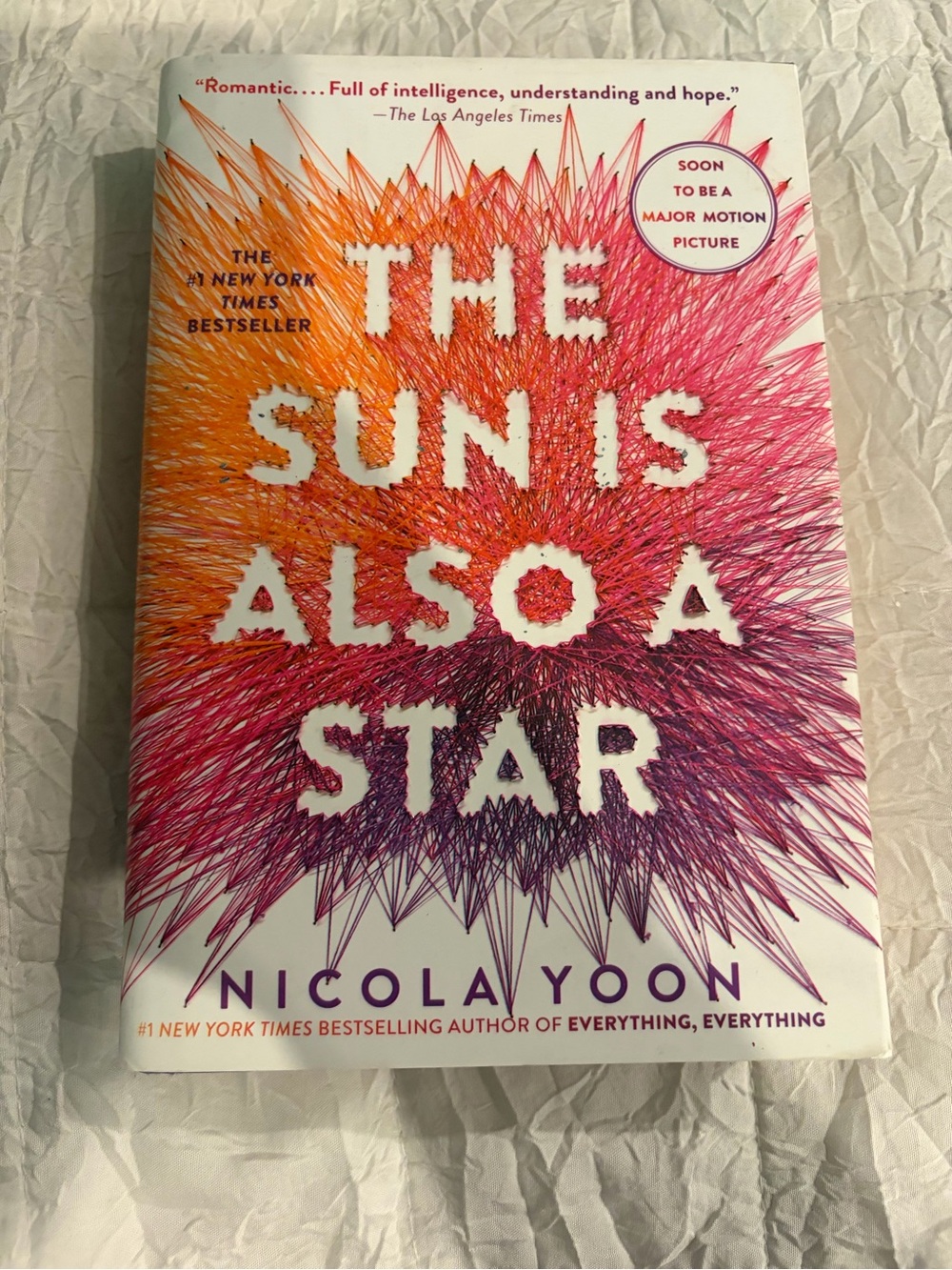 The Sun Is Also A Star by Nicola Yoon - Vibrant Orange-Pink-Purple Cover